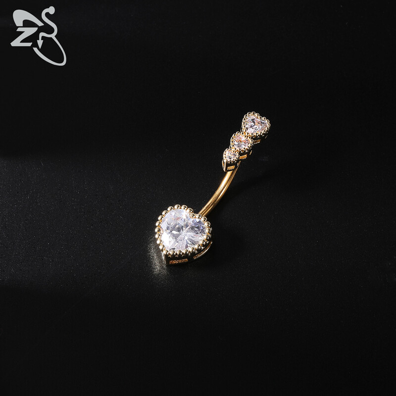 Piercing do pupka z nehrdzavejúcej ocele 14G zlatej farby s hadím srdcom a lesklým CZ krištáľom v tvare motýľa.