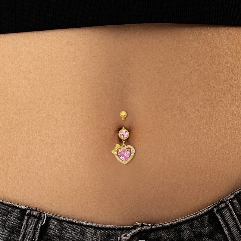 Piercing do pupka s ružovým zirkónom v tvare srdca, mašľou a zlatým náušníkom pre ženy