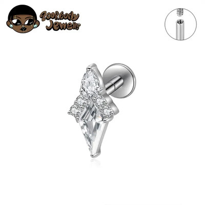 Piercing do ucha s diamantom, modrým a zlatým náušnicou, ASTM F136, titánové náušnice, chrupavka, špirála, tragus, lastúra, šperky.