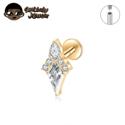 Piercing do ucha s diamantom, modrým a zlatým náušnicou, ASTM F136, titánové náušnice, chrupavka, špirála, tragus, lastúra, šperky.