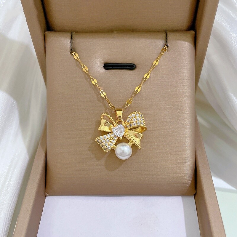 Klasszikus rozsdamentes acél gyönyörű gyöngy masni nyaklánc fülbevaló Divatos és remek temperamentumú esti kiegészítők