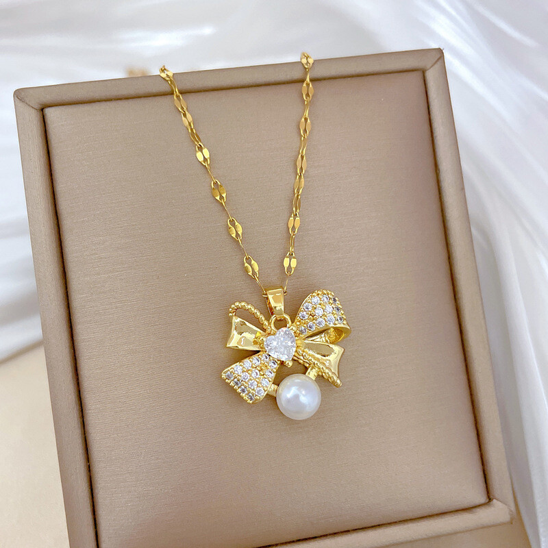 Klasszikus rozsdamentes acél gyönyörű gyöngy masni nyaklánc fülbevaló Divatos és remek temperamentumú esti kiegészítők