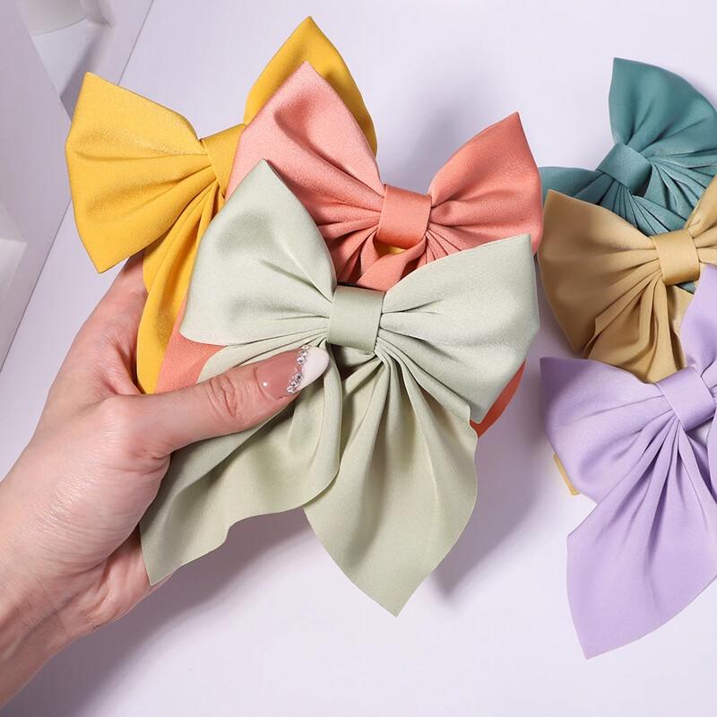 Új Sweet Bows Hajtűk Egyszínű Bowknot Hajcsatok Lányoknak Szatén Pillangó Barrettes Kacsacsőrű Clip gyerekeknek Hajkiegészítők