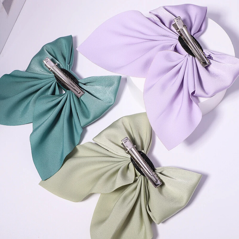 Új Sweet Bows Hajtűk Egyszínű Bowknot Hajcsatok Lányoknak Szatén Pillangó Barrettes Kacsacsőrű Clip gyerekeknek Hajkiegészítők