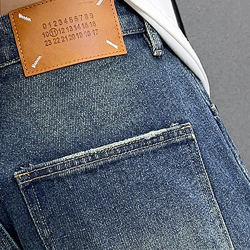 Išskalbti nelaimingi madingi ir madingi džinsai amerikietiško stiliaus madingi vyriški laisvi vyriški džinsai tiesiomis kojomis