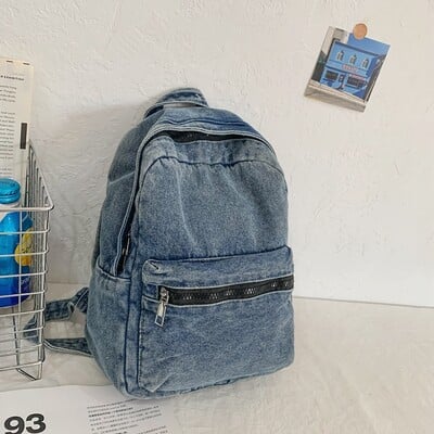 Un rucsac clasic popular din denim de culoare solidă, țesătură confortabilă, capacitate mare, potrivit pentru călătoriile de afaceri care fac naveta