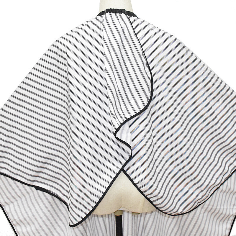 Ρυθμιζόμενη ασπρόμαυρη λωρίδα Υψηλής ποιότητας κούρεμα κομμωτηρίου κουρέας Πανί αδιάβροχο φόρεμα κούρεμα μαλλιών/Κάπα κουρέων