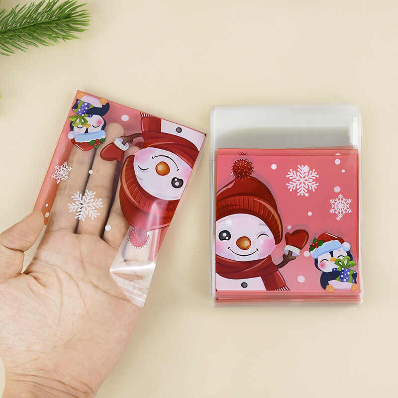 100 ks vianočných sušienok, cukríkových vrecúšok, Santa Claus, snehuliak, sušienky, občerstvenie, plastové baliace vrecká, novoročné, vianočné párty potreby.