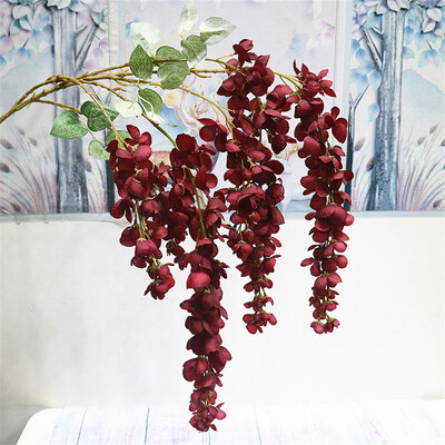 Naujas pristatymas One Silk Wisteria kabantis žalumynas, dirbtinis 6 gėlių stygos auksinis dušo medžio šakelė, skirta sienų gėlių dekoravimui