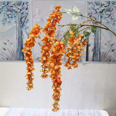 Naujas pristatymas One Silk Wisteria kabantis žalumynas, dirbtinis 6 gėlių stygos auksinis dušo medžio šakelė, skirta sienų gėlių dekoravimui