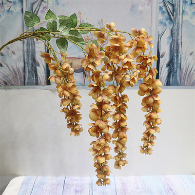Naujas pristatymas One Silk Wisteria kabantis žalumynas, dirbtinis 6 gėlių stygos auksinis dušo medžio šakelė, skirta sienų gėlių dekoravimui