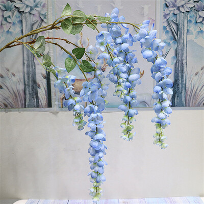 Naujas pristatymas One Silk Wisteria kabantis žalumynas, dirbtinis 6 gėlių stygos auksinis dušo medžio šakelė, skirta sienų gėlių dekoravimui