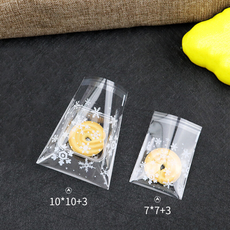 100 bucăți saci de bomboane de Crăciun cu fulgi de zăpadă, biscuiți transparenți, pentru gustări, pachete pungi autoadezive, pachet de copt pentru petrecerea de Crăciun