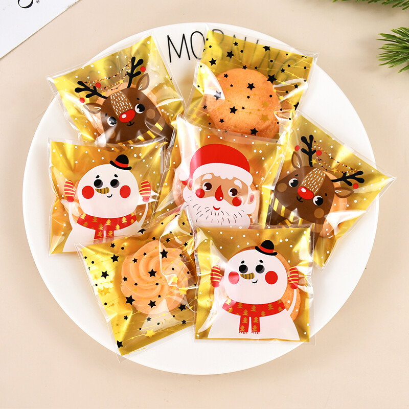 100gab Ziemassvētku konfekšu maisiņi Ziemassvētku vecīša sniegavīrs aļņa cepumu dāvanu plastmasas iepakojuma maisiņi 2025. gada Jaungada Ziemassvētku ballīšu rotājumi