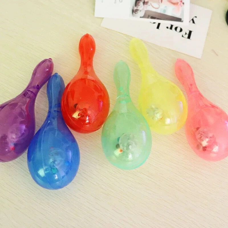 12 vnt Šviečiantys mini marakasai žaislai plastikiniai marakasai vakarėliui. Meksikietiškas marakasų plaktuvas Neoninis vaikiškas marakasų triukšmadaris vaikams Dovanos