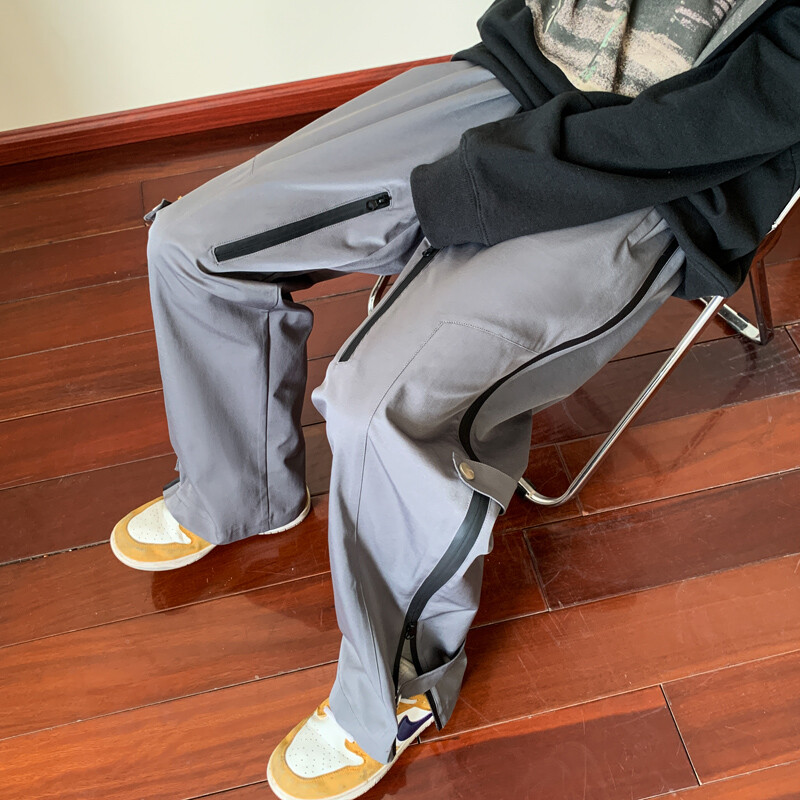 Amerikietiškos funkcionalaus stiliaus įžeidžiančios vyriškos kelnės rudenį naujos darbo dėvimos sportinės neperšlampamos juodos vasarinės laisvalaikio kelnės vyrams