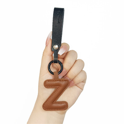 Aranyos PU bőr betűkkel kulcstartó AZ színes kezdőbetűkkel függő karkötővel Női Lányoknak Kézitáskák Pénztárca Bűvészek Kiegészítők