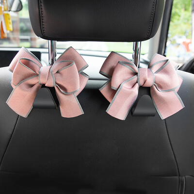 Universālie sēdekļa atzveltņu organizētāji 2 iepakojumā, jauki Bowknot automašīnas galvas balstu somu pakaramie Spēcīgi, izturīgi automātiskās aizmugurējās sēdekļa glabāšanas āķi