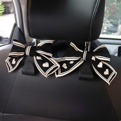 Universālie sēdekļa atzveltņu organizētāji 2 iepakojumā, jauki Bowknot automašīnas galvas balstu somu pakaramie Spēcīgi, izturīgi automātiskās aizmugurējās sēdekļa glabāšanas āķi