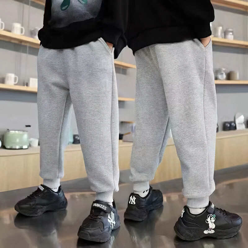 Нови пролетни и есенни едноцветни момчешки свободни и удобни тънки панталони Полиестерни спортни панталони за свободното време с ластик на талията Предпазни панталони за крака