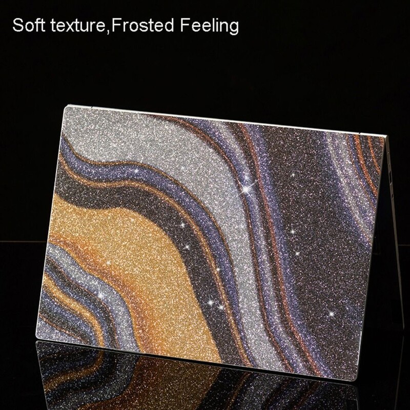 16-tollised sülearvuti kleebised katavad säravaid nahka