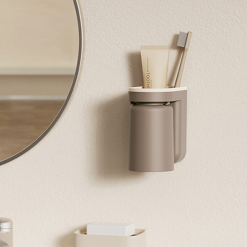 Daudzfunkcionāls zobu birstes statīvs Bez štancēšanas pie sienas stiprināms mutes skalošanas trauks Zobu birstes krūze Vannas istabas uzglabāšanas plaukta turētāja piederumi