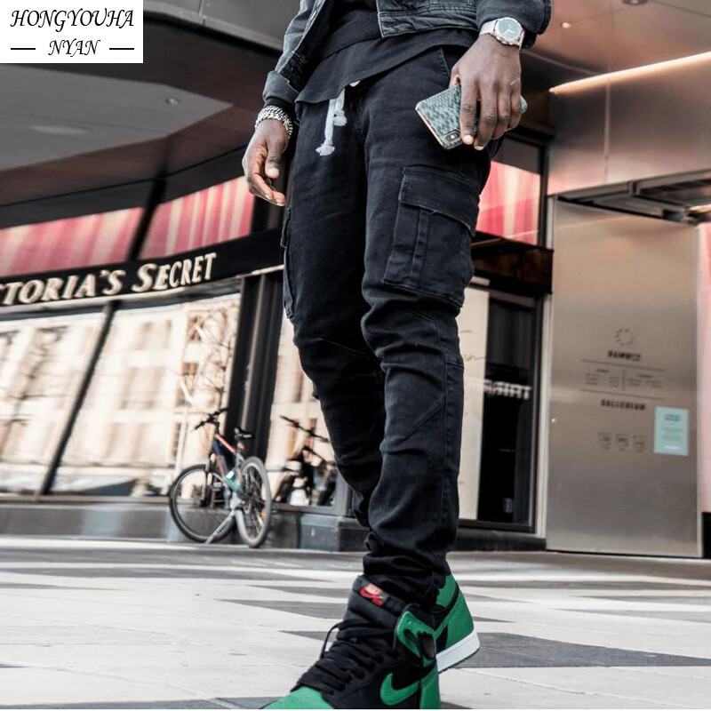 Masīvas vīriešu bikses ar vairākām kabatām Ērtas ikdienas ielas stila bikses vīriešiem āra aktivitātēm Džinsi Vīriešu apģērbi