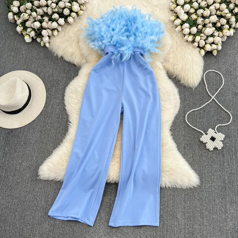 Sieviešu kombinezoni ar spalvām savienoti ar jostu, vienkrāsaini ar augstu vidukli. Bikses ar taisnām kājām Šiki, šauri sieviešu bodi