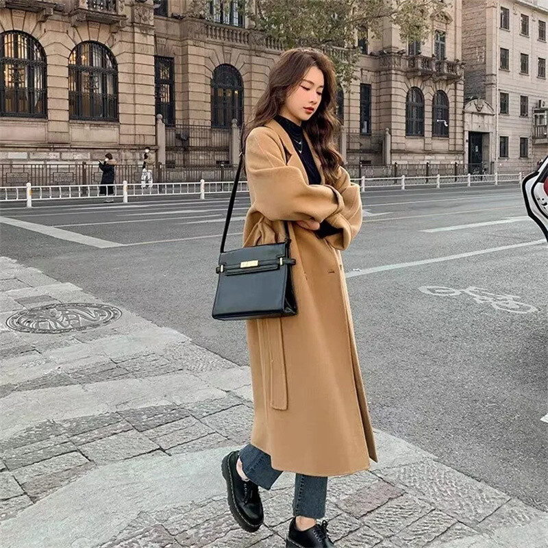 Vilnas mētelis 2024. gada pavasarī un rudenī jauns stils, moderns elegance korejiešu izdevums, brīvs vidēja garuma siksniņa sieviešu vilnas mētelis