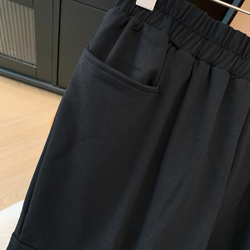 Pavasara un rudens sieviešu lielizmēra melnas ikdienas bikses brīvas elastīgas jostasvietas cargo deviņu ceturtdaļu bikses 2024 jaunas lielas kabatas bikses