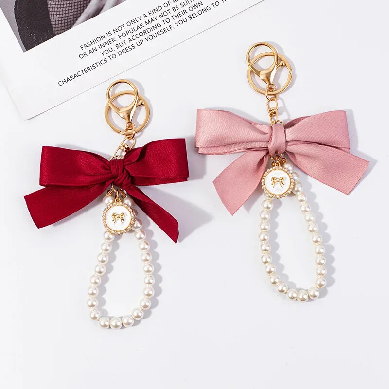 Vintage Faux Pearl Chain võtmehoidjad naistele Armsad südamed vibu-sõlme võlu Käekott Rahakott Decor auto võtmehoidja kõrvaklappide ümbris Aksessuaar