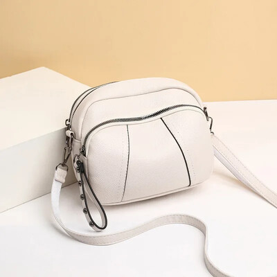 Vienkrāsains moderns kniedēts rāvējslēdzējs sieviešu mobilā tālruņa soma Vienkārša mīksta ādas plecu krustojuma maza kvadrātveida soma rokassomiņa