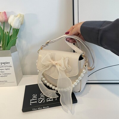 Melna sieviešu plecu soma korejiešu loku mezglu modes soma ar augšpusi ar rokturi sievietēm audekls, liela soma padusē 2024. gada dizaineru jaunas rokassomas