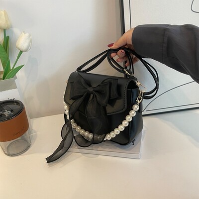 Melna sieviešu plecu soma korejiešu loku mezglu modes soma ar augšpusi ar rokturi sievietēm audekls, liela soma padusē 2024. gada dizaineru jaunas rokassomas