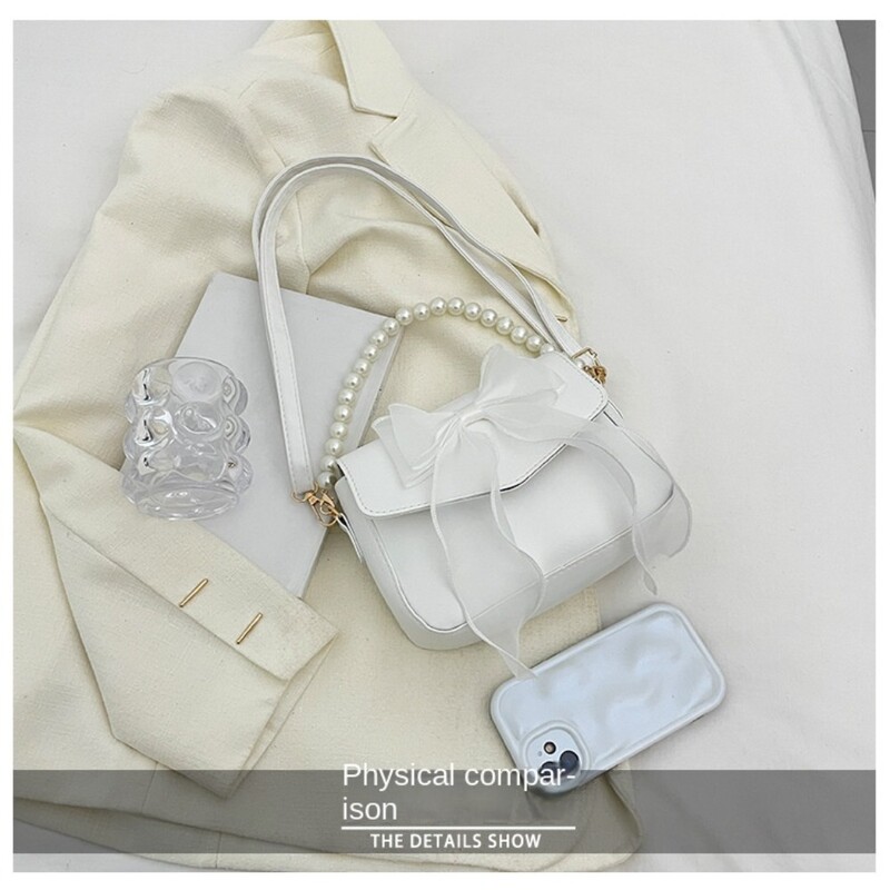 Melna sieviešu plecu soma korejiešu loku mezglu modes soma ar augšpusi ar rokturi sievietēm audekls, liela soma padusē 2024. gada dizaineru jaunas rokassomas