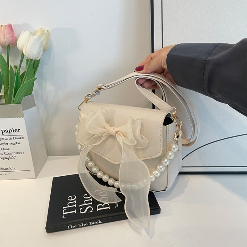 Melna sieviešu plecu soma korejiešu loku mezglu modes soma ar augšpusi ar rokturi sievietēm audekls, liela soma padusē 2024. gada dizaineru jaunas rokassomas