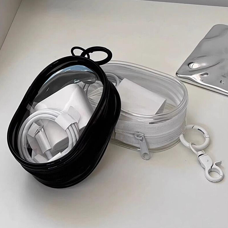 Crno bijela ovalna PVC prozirna kozmetička torbica Organizator Torbica za prikaz lutke Prijenosne slušalice Data kabel Punjač Torbica za pohranu