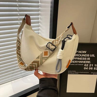 2025. gada jauna modes krustojuma soma, vienkārša, plata plecu siksnas dizaina viena plecu soma oriģinālā stila pārvietošanās klimpu sieviešu soma