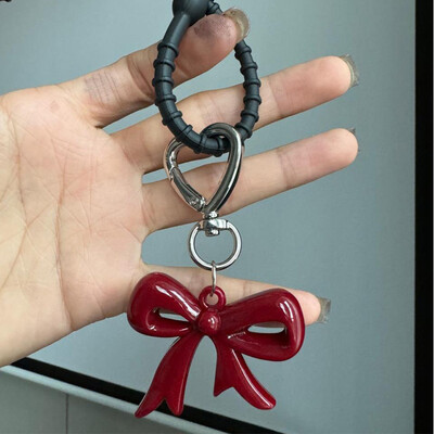 Izsmalcināta temperamenta sarkana sirds loku piekariņi Atslēgu piekariņš Daudzpusīgs tālruņa kulons Modes mugursoma Piekarināms Ornaments Aksesuāri Dāvanas