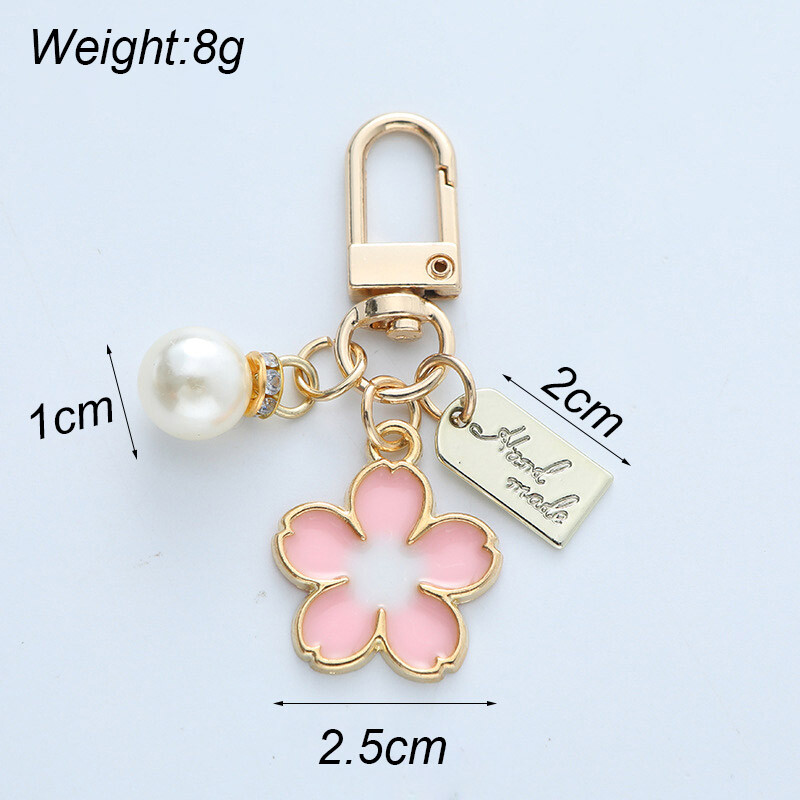 Modni ženski privjesak za ključeve od imitacije cvijeta trešnje Jednostavan privjesak za ključeve sa slovom, torbica, torbica, ukrasni nakit