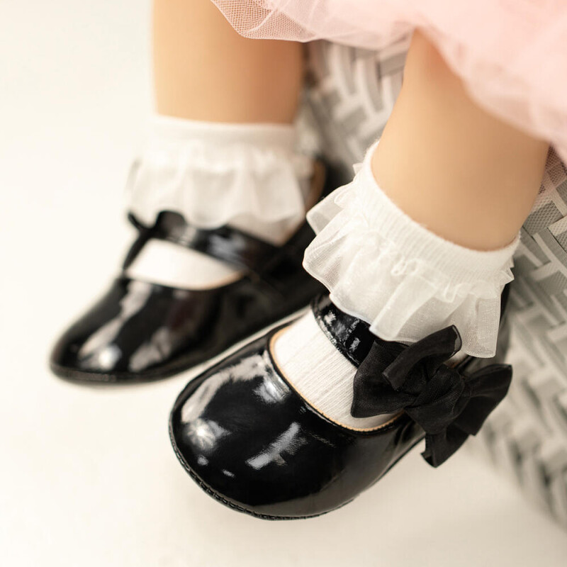 Sonsage vienkrāsains, sekla mutes apavi zīdaiņu pastaigu apaviem Mīkstas bantes, mīkstas ādas princešu apavi Viegli elpojoši apavi mazuļiem