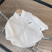 Bērnu balts krekls ar garām piedurknēm Stilīgs, vienkāršs bērnu tops 2024. gada pavasarim un rudenim, moderns jauna stila burtu tops