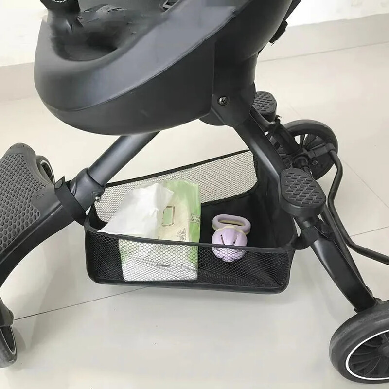 Universāla bērnu ratiņu apakšas organizatora soma, pārnēsājams auduma auduma rotaļlietu uzglabāšanas grozs ar cieto dēļu ratiņu piederumiem, melns