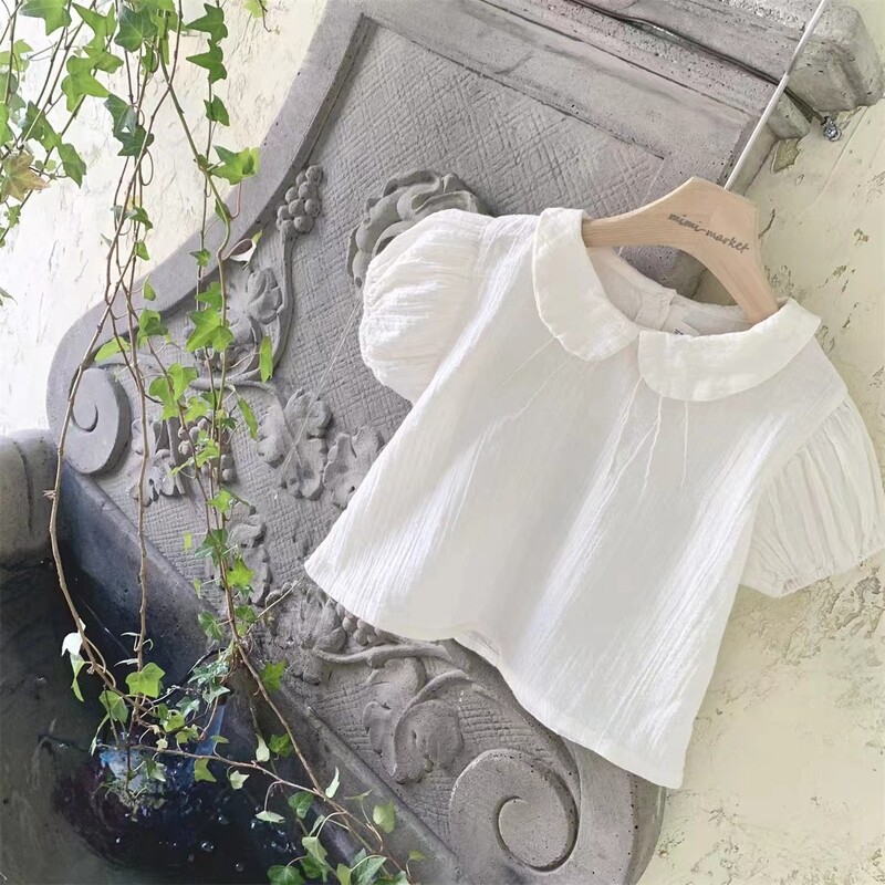 2025. gada vasara Jauna mazuļu meiteņu vienkrāsaini krekli ar piedurknēm Kokvilnas zīdaiņu T krekli Toddler Ikdienas atloks Krekli Bērnu apģērbi