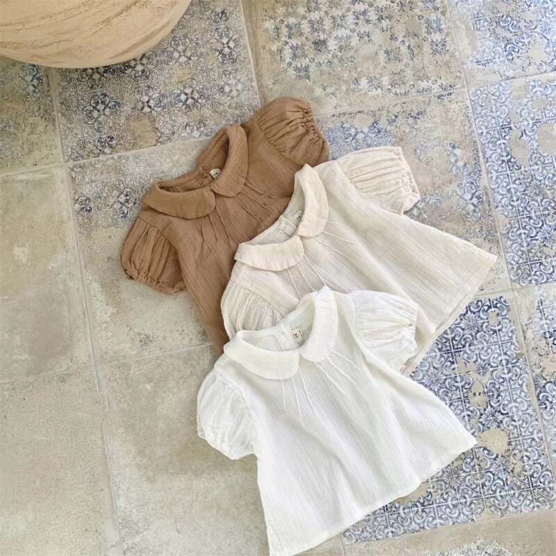 2025. gada vasara Jauna mazuļu meiteņu vienkrāsaini krekli ar piedurknēm Kokvilnas zīdaiņu T krekli Toddler Ikdienas atloks Krekli Bērnu apģērbi