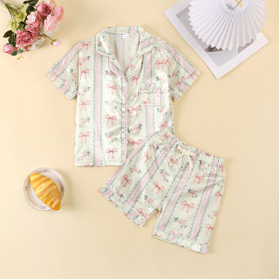 Zīdaiņu zīdaiņu meiteņu atpūtas apģērbs Vasaras mazuļu pidžamas komplekts bantītes ziedu raksta pogai ar īsām piedurknēm Topi Šorti Mazu bērnu mājas apģērbi