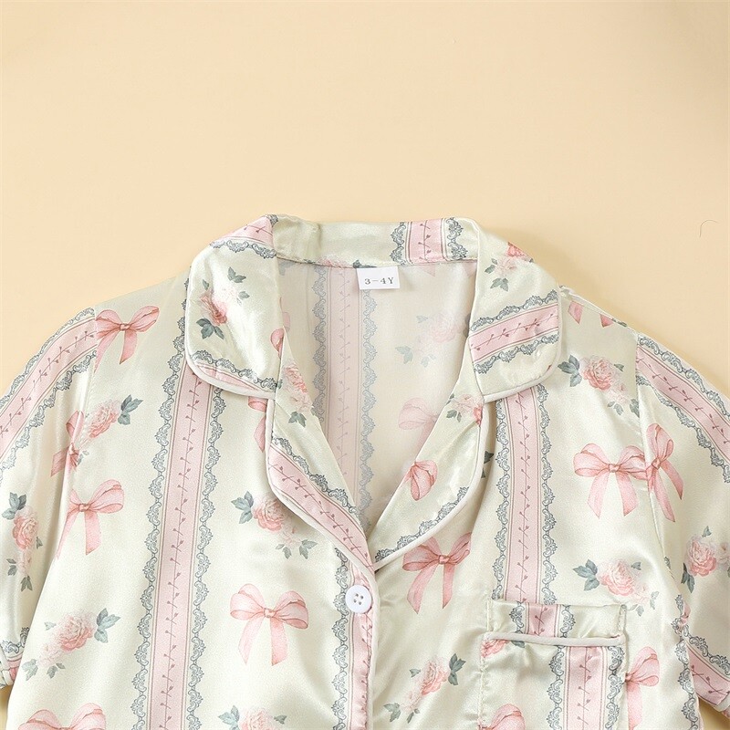 Zīdaiņu zīdaiņu meiteņu atpūtas apģērbs Vasaras mazuļu pidžamas komplekts bantītes ziedu raksta pogai ar īsām piedurknēm Topi Šorti Mazu bērnu mājas apģērbi