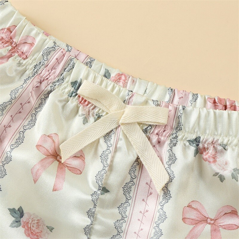 Zīdaiņu zīdaiņu meiteņu atpūtas apģērbs Vasaras mazuļu pidžamas komplekts bantītes ziedu raksta pogai ar īsām piedurknēm Topi Šorti Mazu bērnu mājas apģērbi