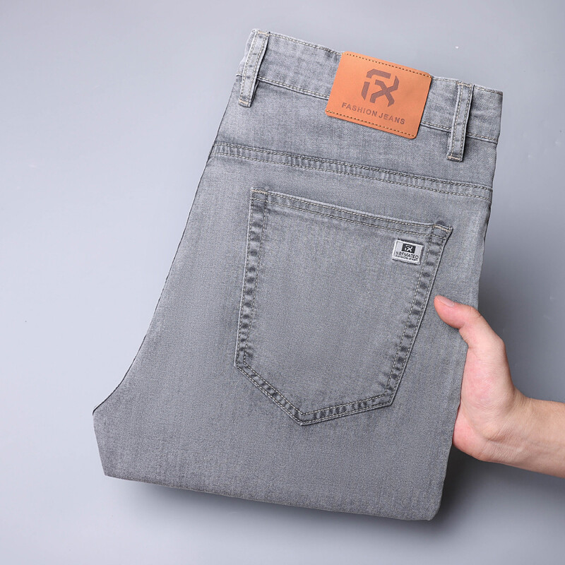 2024 m. pavasaris vasara Vyriški tamprūs džinsai Madingi laisvalaikio plonos džinsinės kelnės Vyriškos mėlynos kelnės Vyriški drabužiai