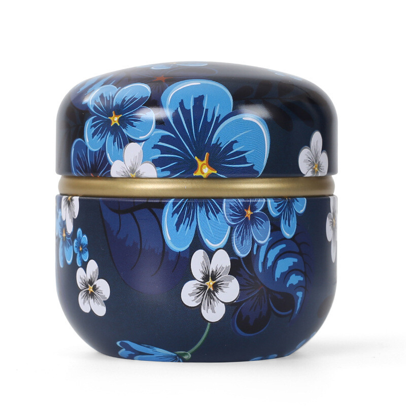 Skārda tējas kastes mājsaimniecības aizzīmogotās tējas iepakojuma kaste pārnēsājamas japāņu stila ziedu tējas mazas apaļas skārda kastes